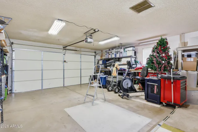 a view of a garage with rack and bicycle