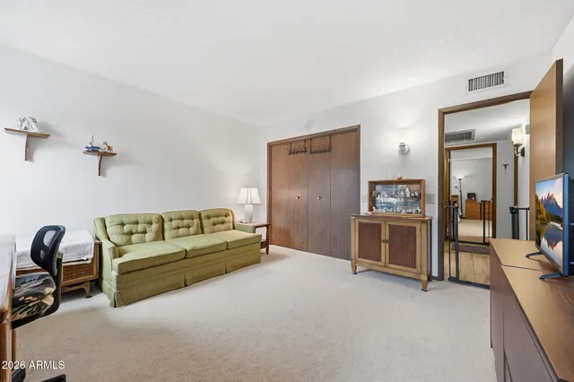 a living room with furniture and a table