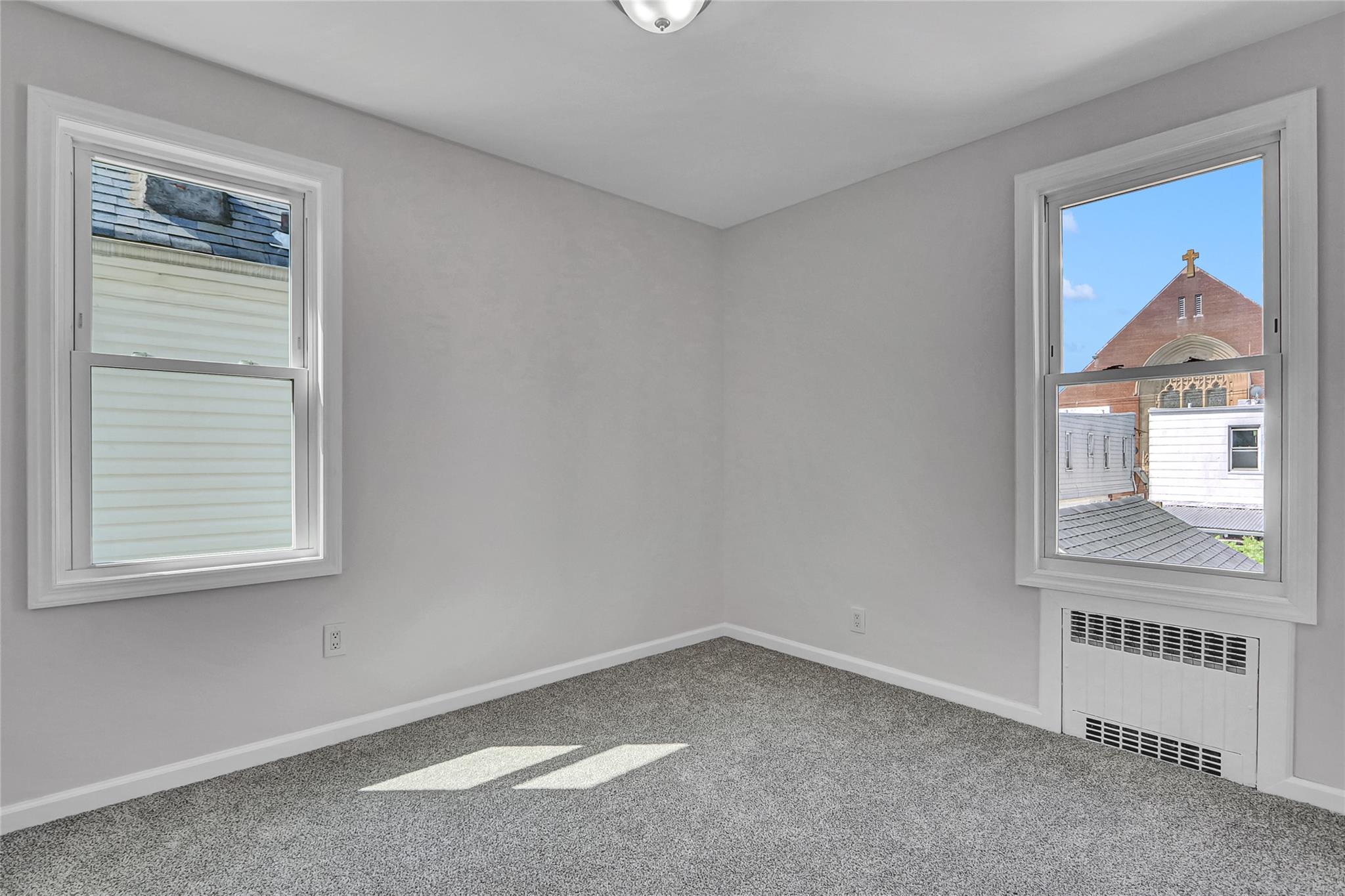 111-32 116th Street Queens, NY 11420 - Photo 13 of 18 an empty room with a window