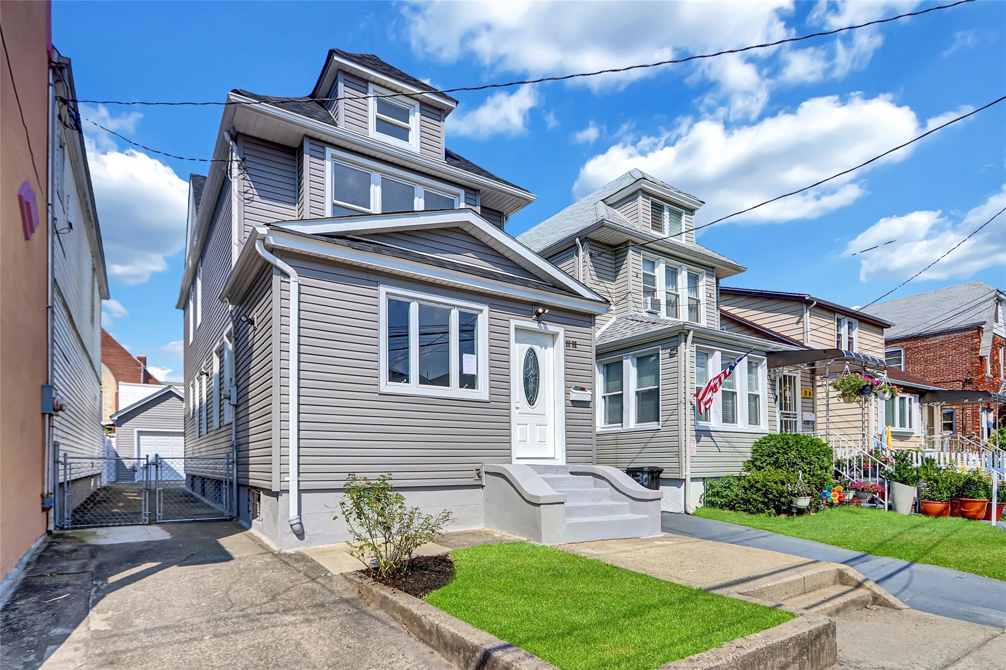 111-32 116th Street Queens, NY 11420 - Photo 3 of 18 a front view of a house with a yard