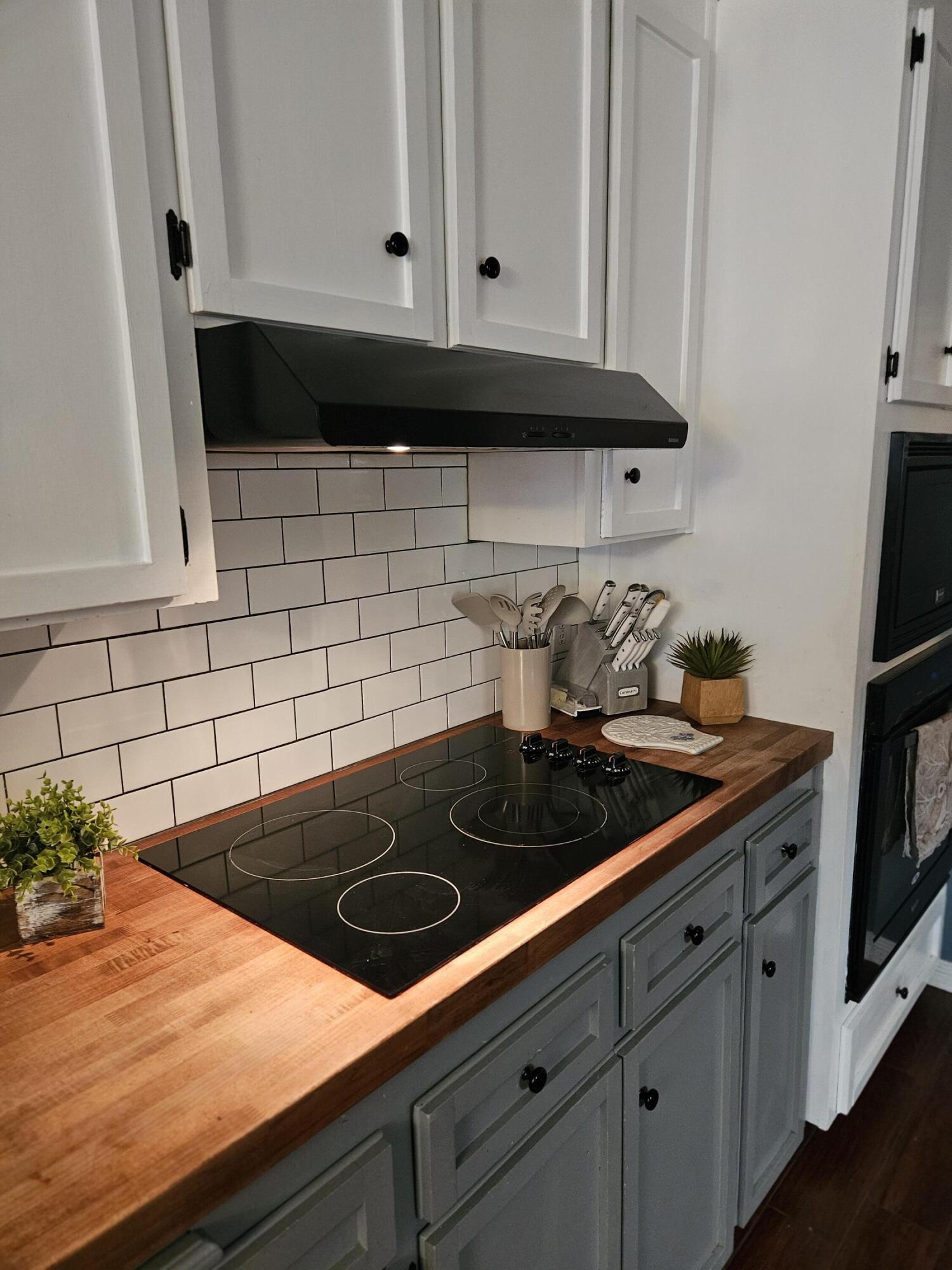 108 Mohawk Trail Crestview, FL 32536 - Photo 13 of 39 a kitchen with an oven a cabinets and a stove