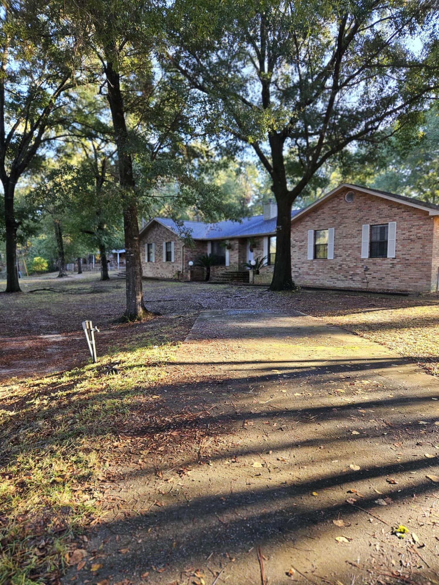 108 Mohawk Trail Crestview, FL 32536 - Photo 2 of 39 a view of house with outdoor space and swimming pool