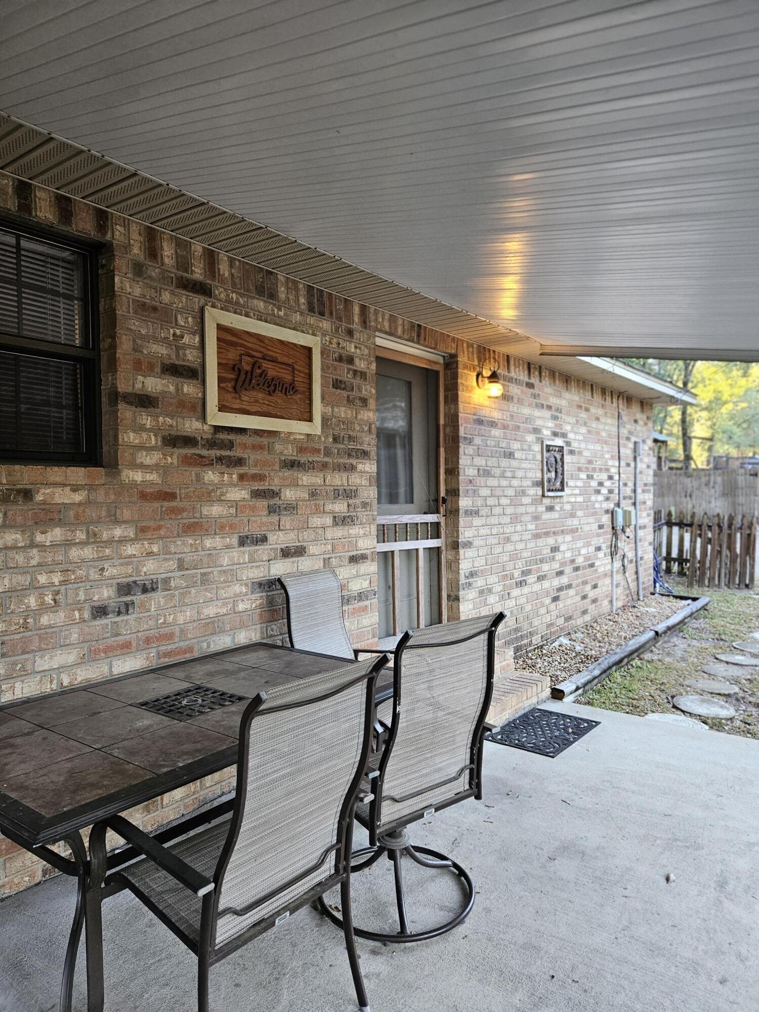108 Mohawk Trail Crestview, FL 32536 - Photo 33 of 39 a backyard of a house with seating space