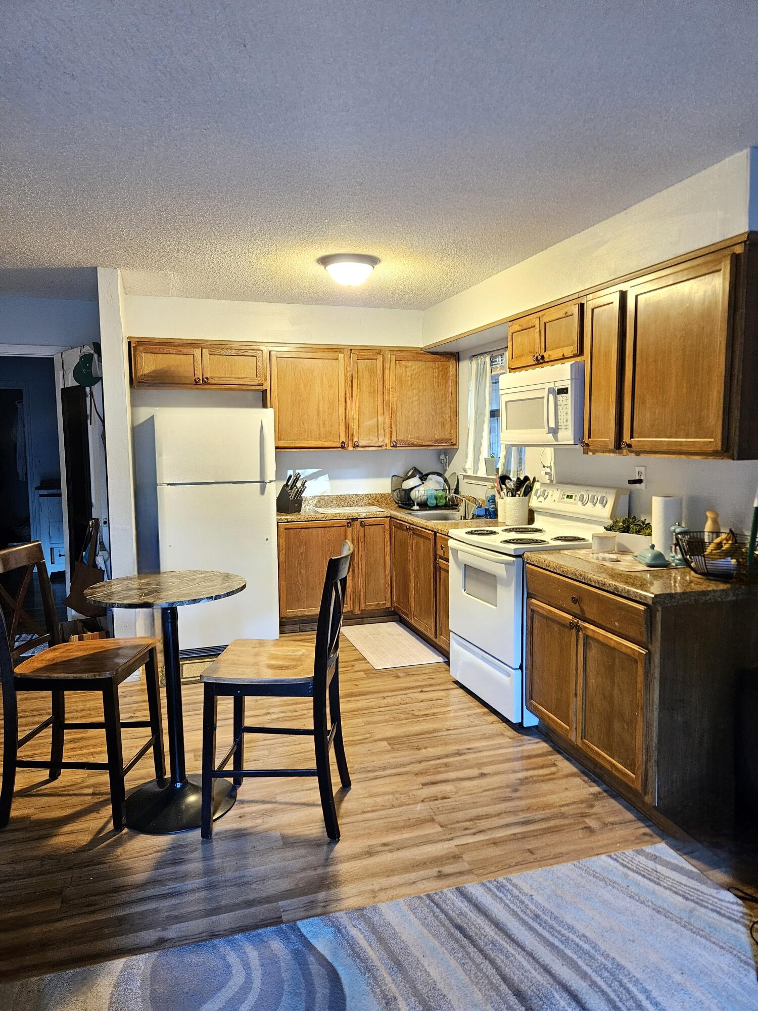 108 Mohawk Trail Crestview, FL 32536 - Photo 37 of 39 a kitchen with stainless steel appliances granite countertop wooden cabinets a stove top oven a sink and dishwasher