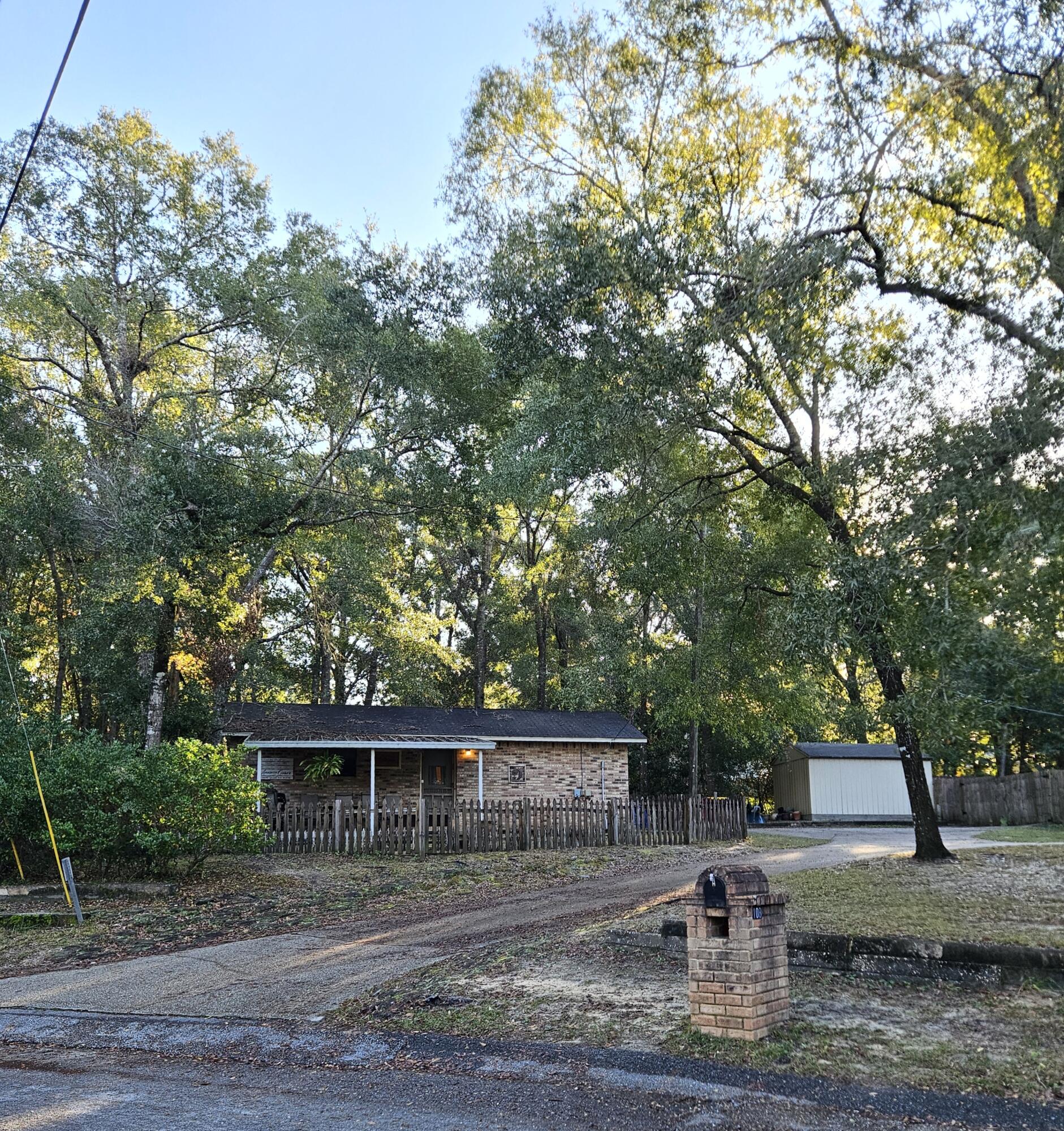 108 Mohawk Trail Crestview, FL 32536 - Photo 39 of 39 a front view of a house with garden