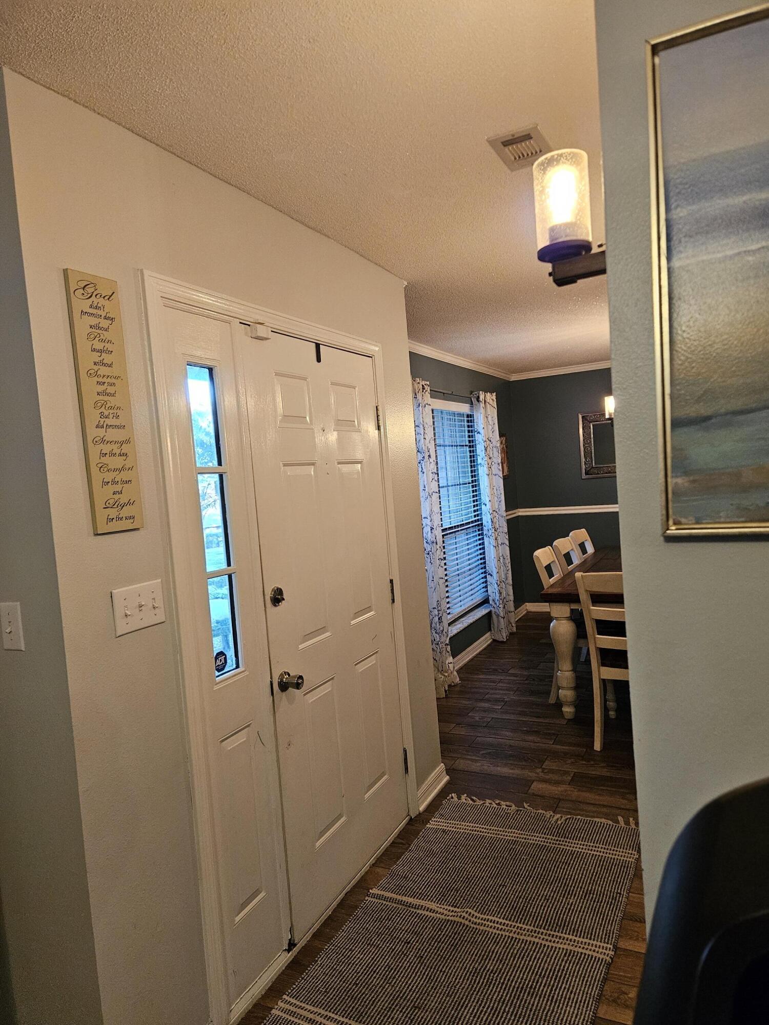 108 Mohawk Trail Crestview, FL 32536 - Photo 5 of 39 a view of a hallway with wooden floor