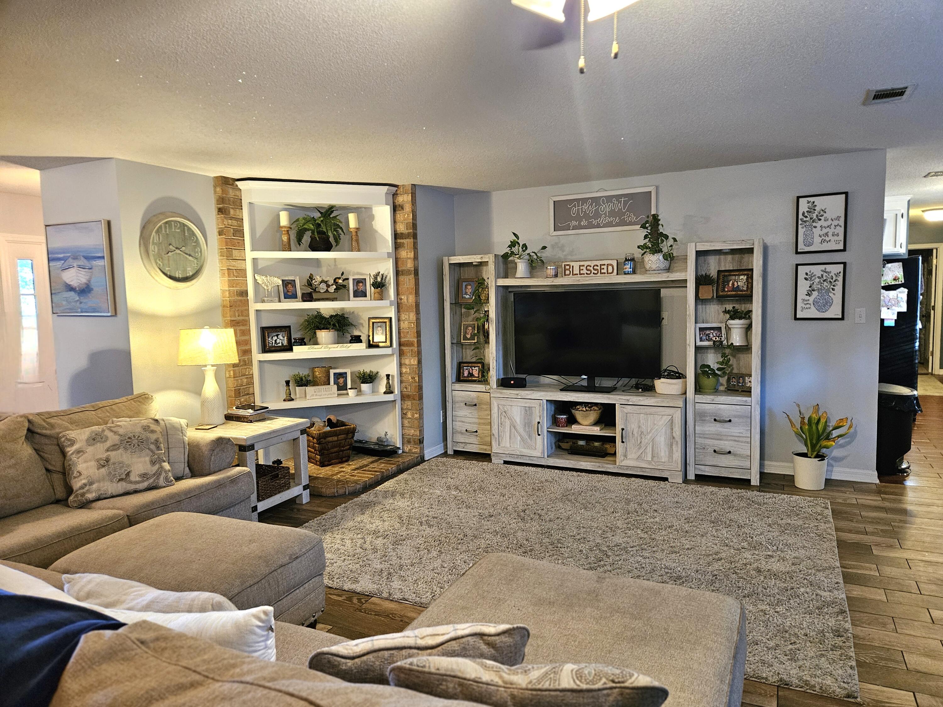 108 Mohawk Trail Crestview, FL 32536 - Photo 8 of 39 a living room with furniture and a flat screen tv