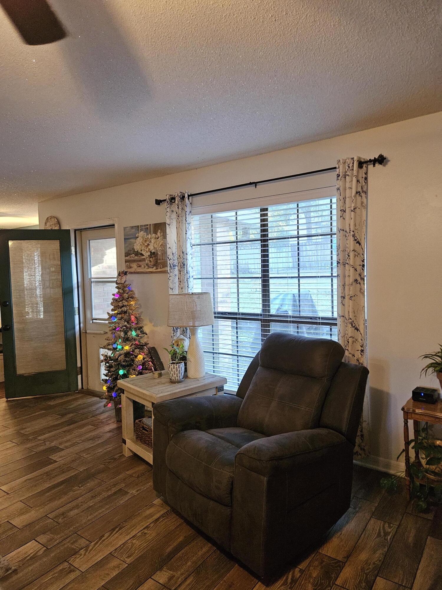108 Mohawk Trail Crestview, FL 32536 - Photo 9 of 39 a living room with furniture and a large window