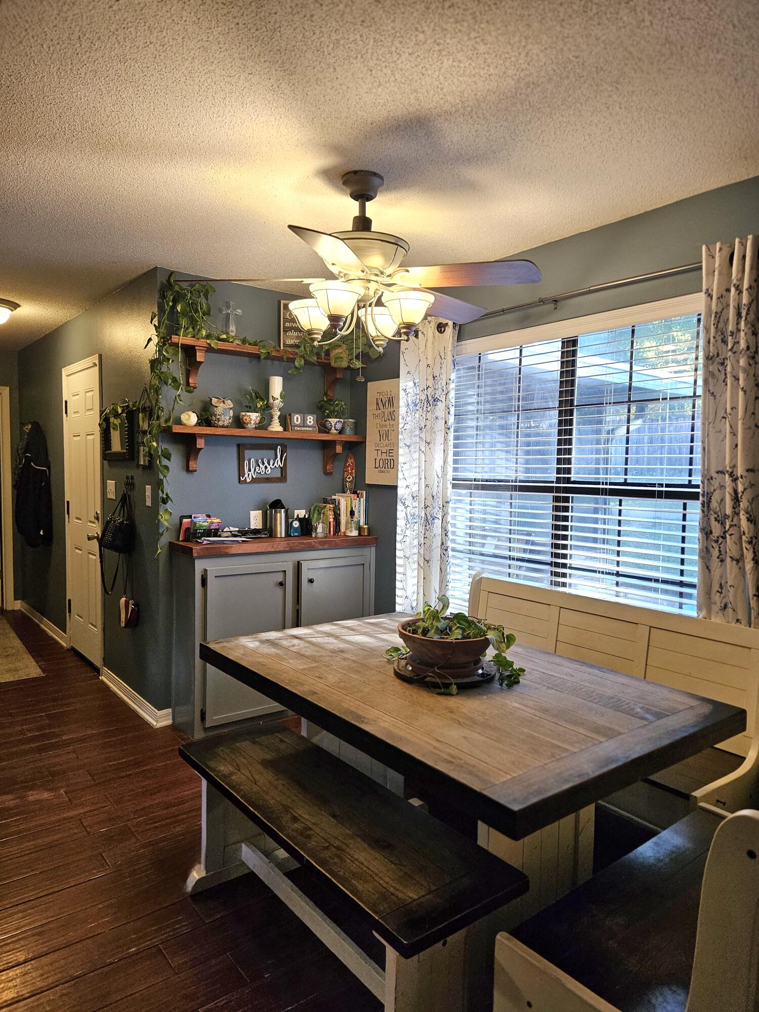 108 Mohawk Trail Crestview, FL 32536 - Photo 10 of 39 a kitchen with a table chairs and flat screen tv