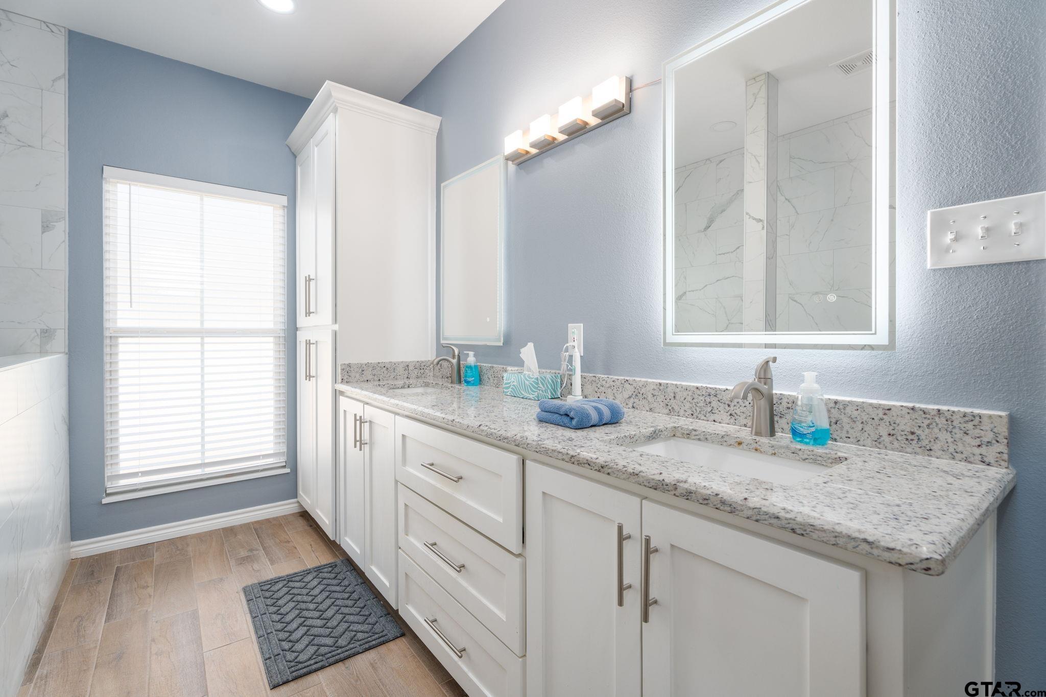 4356 Buie Road Diana, TX 75640 - Photo 12 of 29 a kitchen with granite countertop a sink stainless steel appliances and a window