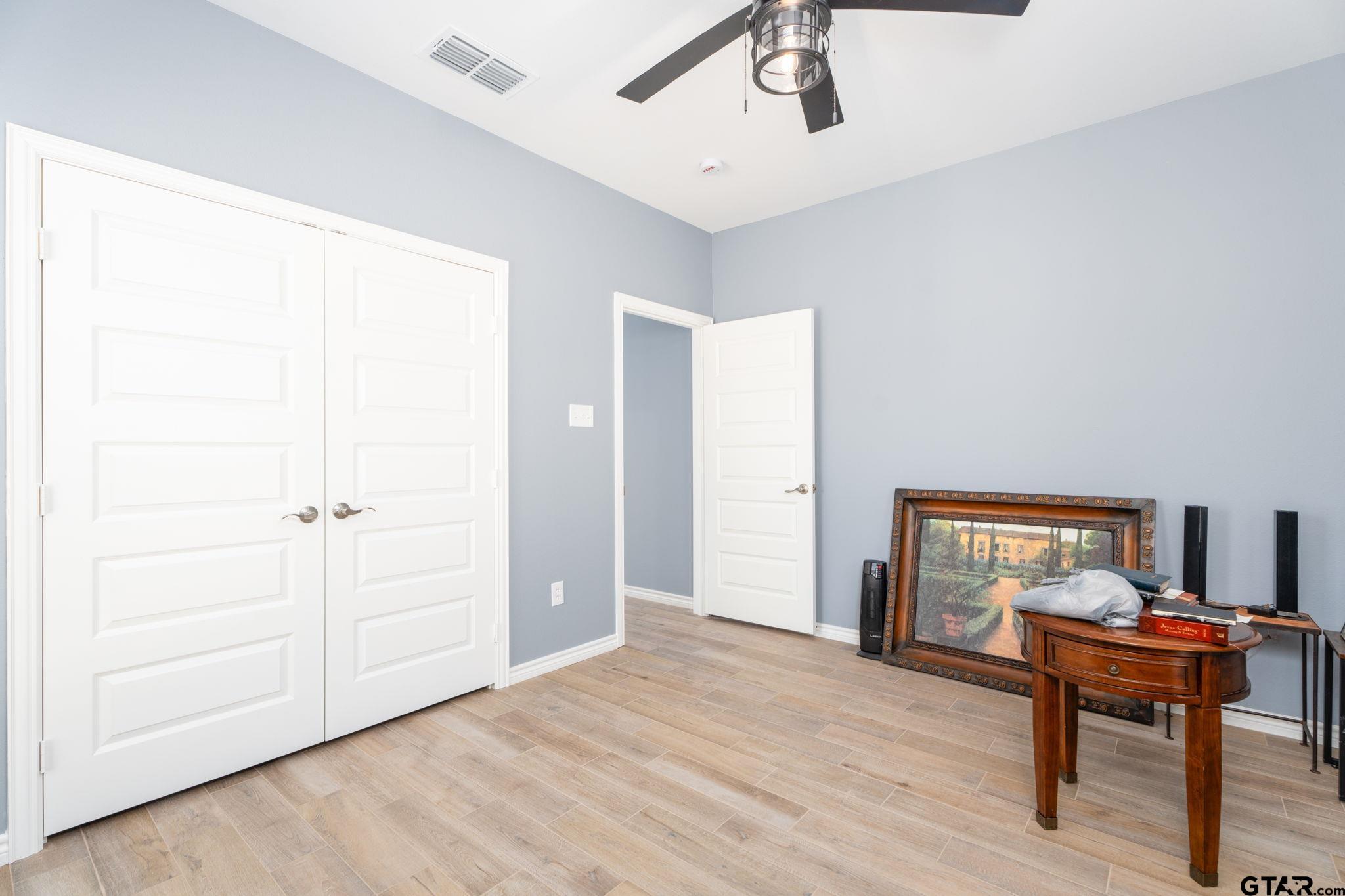 4356 Buie Road Diana, TX 75640 - Photo 16 of 29 a view of a livingroom with a hardwood and a ceiling fan