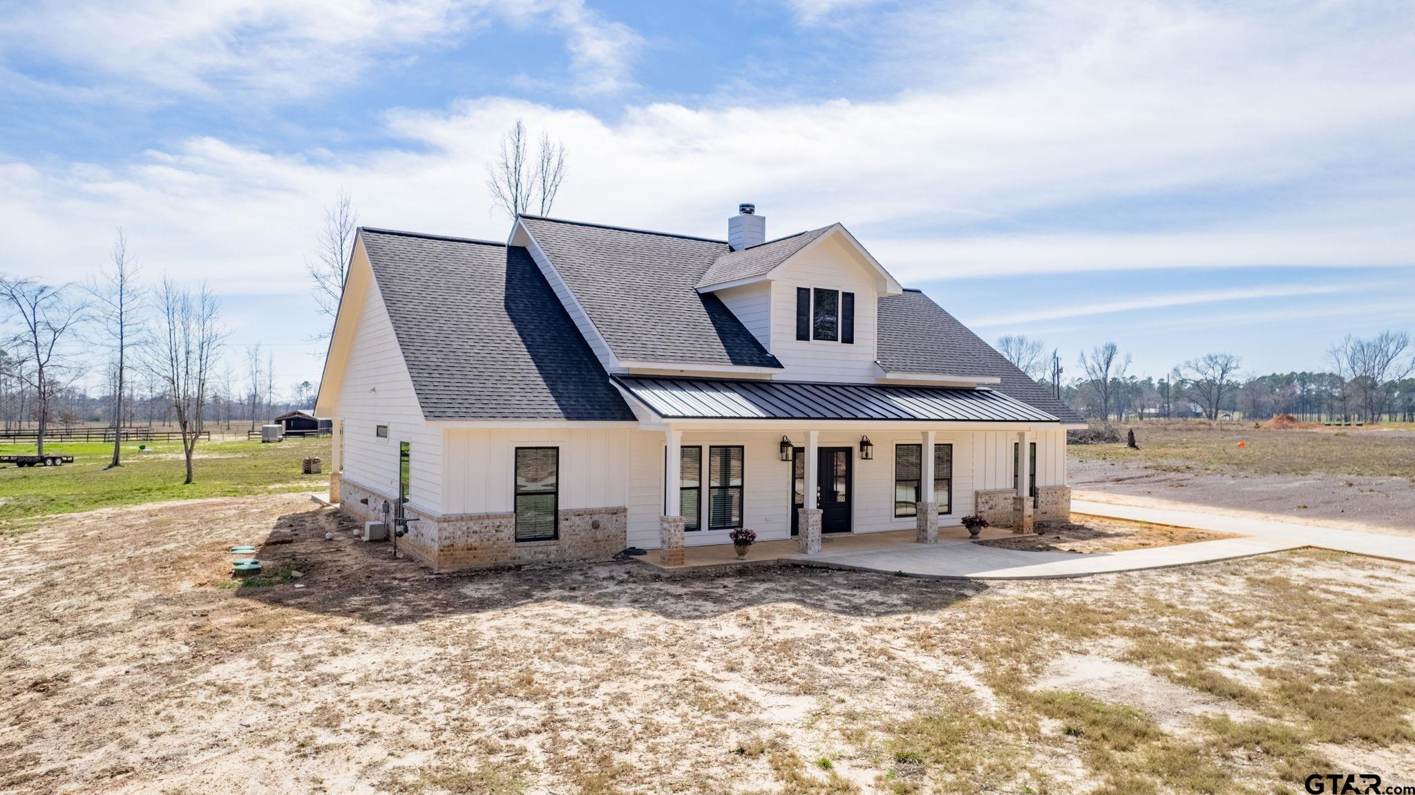 4356 Buie Road Diana, TX 75640 - Photo 2 of 29 a front view of a house with a yard