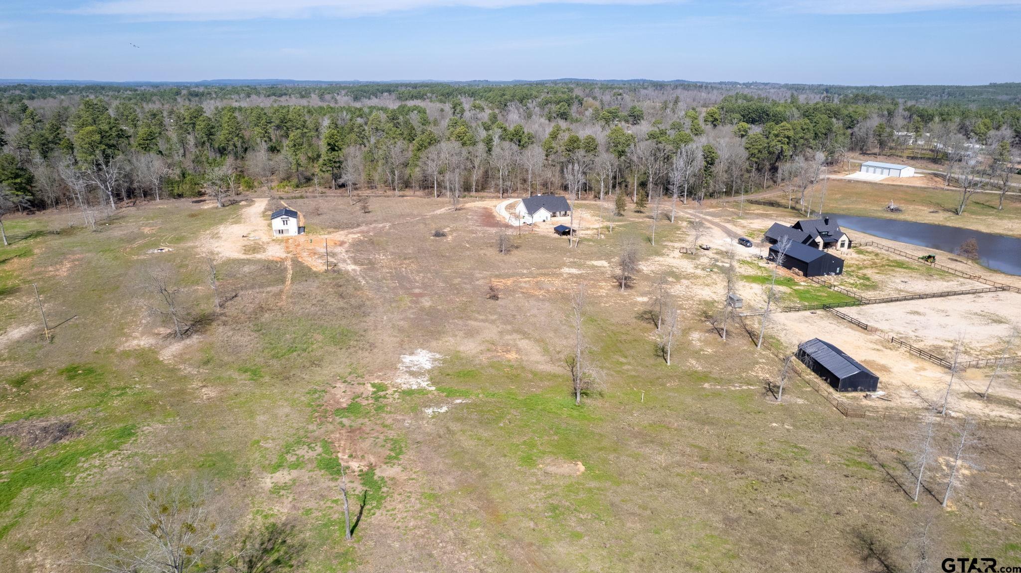 4356 Buie Road Diana, TX 75640 - Photo 28 of 29 a view of a backyard of a house with a yard