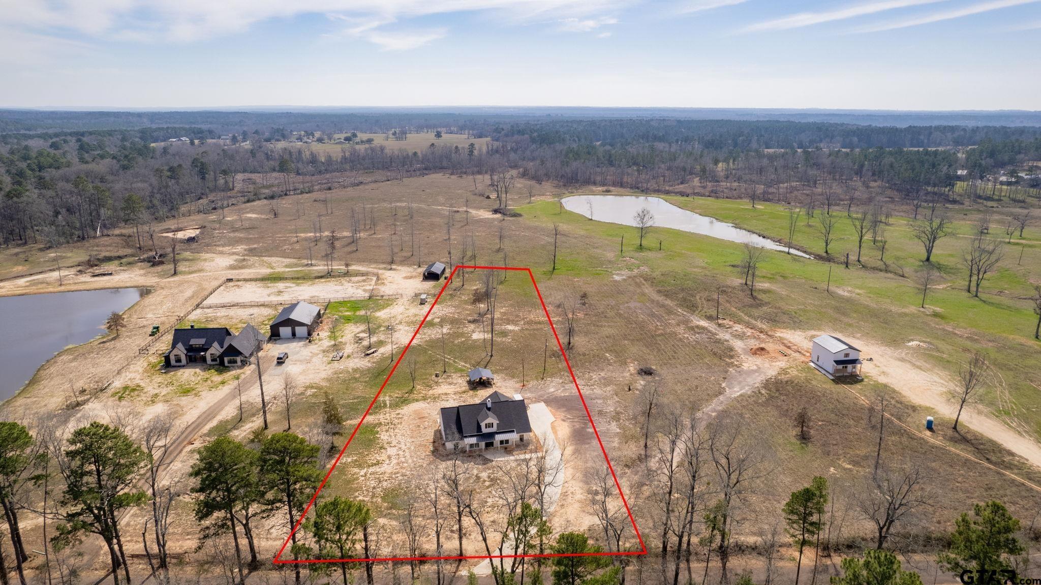 4356 Buie Road Diana, TX 75640 - Photo 3 of 29 a view of a lake in middle of the town