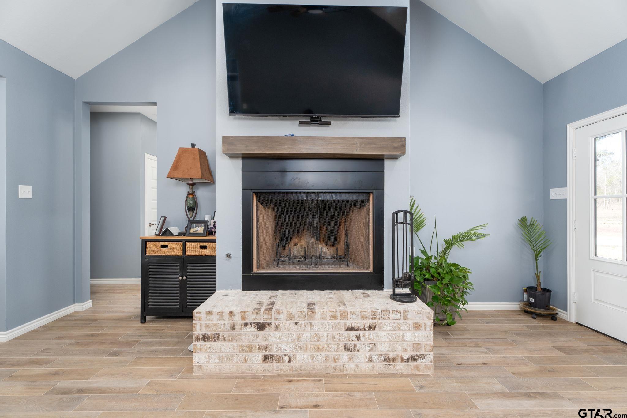 4356 Buie Road Diana, TX 75640 - Photo 6 of 29 a living room with furniture and a fireplace