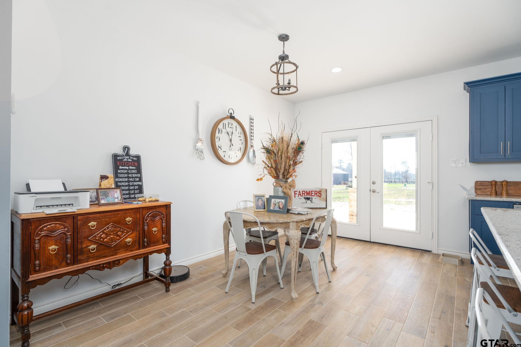 4356 Buie Road Diana, TX 75640 - Photo 9 of 29 a view of a dining room with furniture window and wooden floor