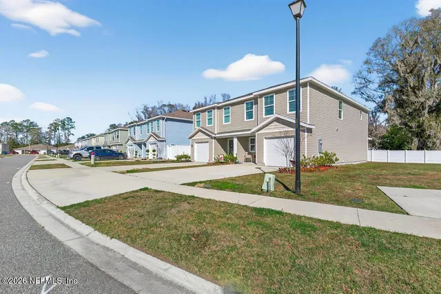a view of a house with a yard