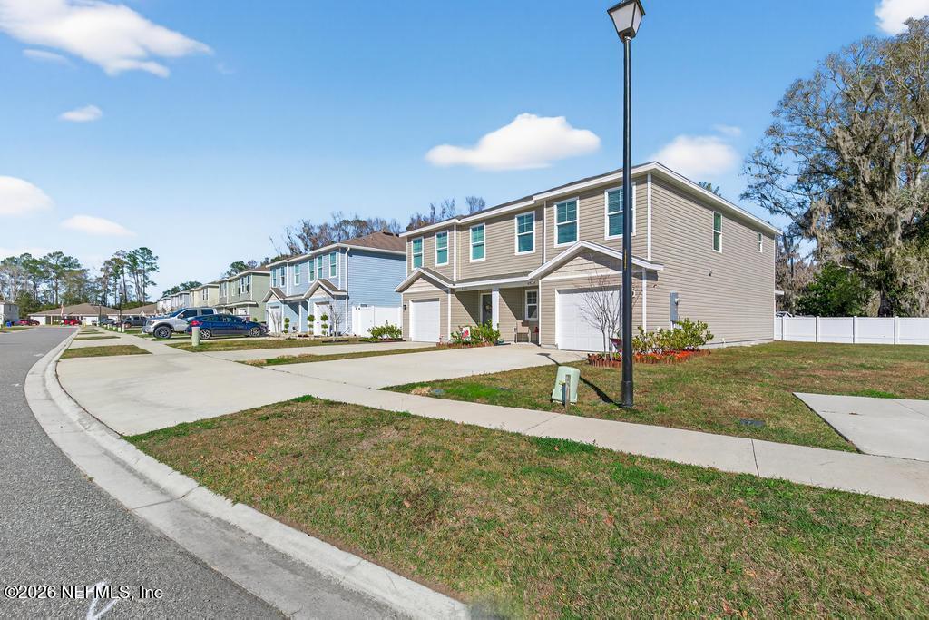 45124 Red Brick Drive Callahan, FL 32011 - Photo 2 of 54 a view of a house with a yard