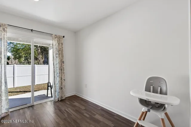 wooden floor in a room next to a window