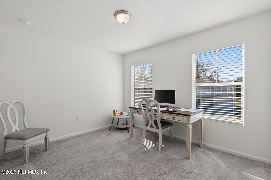 45124 Red Brick Drive Callahan, FL 32011 - Photo 27 of 54 a view of a workspace with furniture and a window