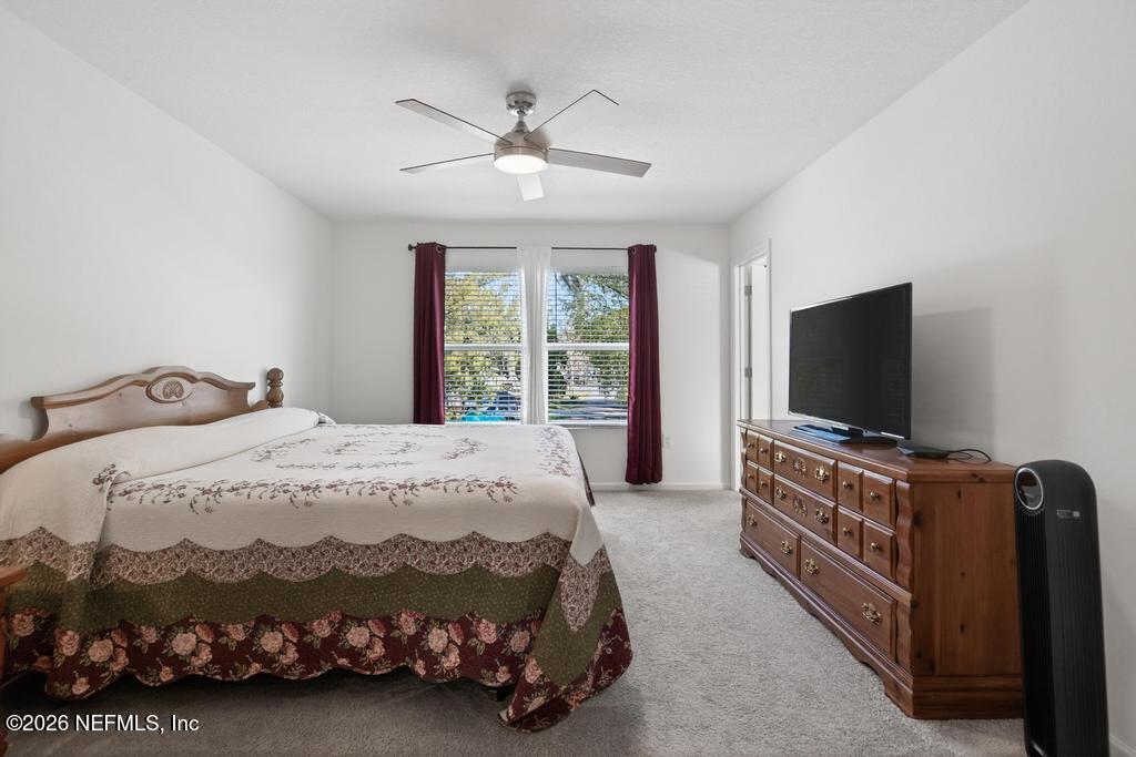 45124 Red Brick Drive Callahan, FL 32011 - Photo 36 of 54 a bedroom with a bed and a flat screen tv