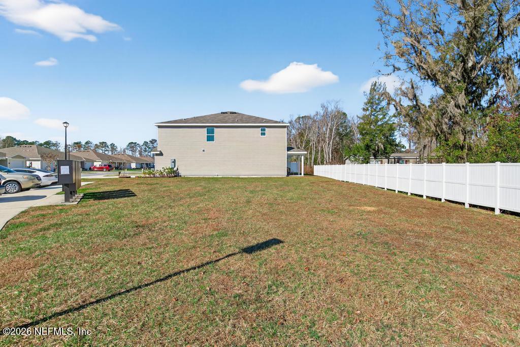 45124 Red Brick Drive Callahan, FL 32011 - Photo 49 of 54 a view of a house with a yard