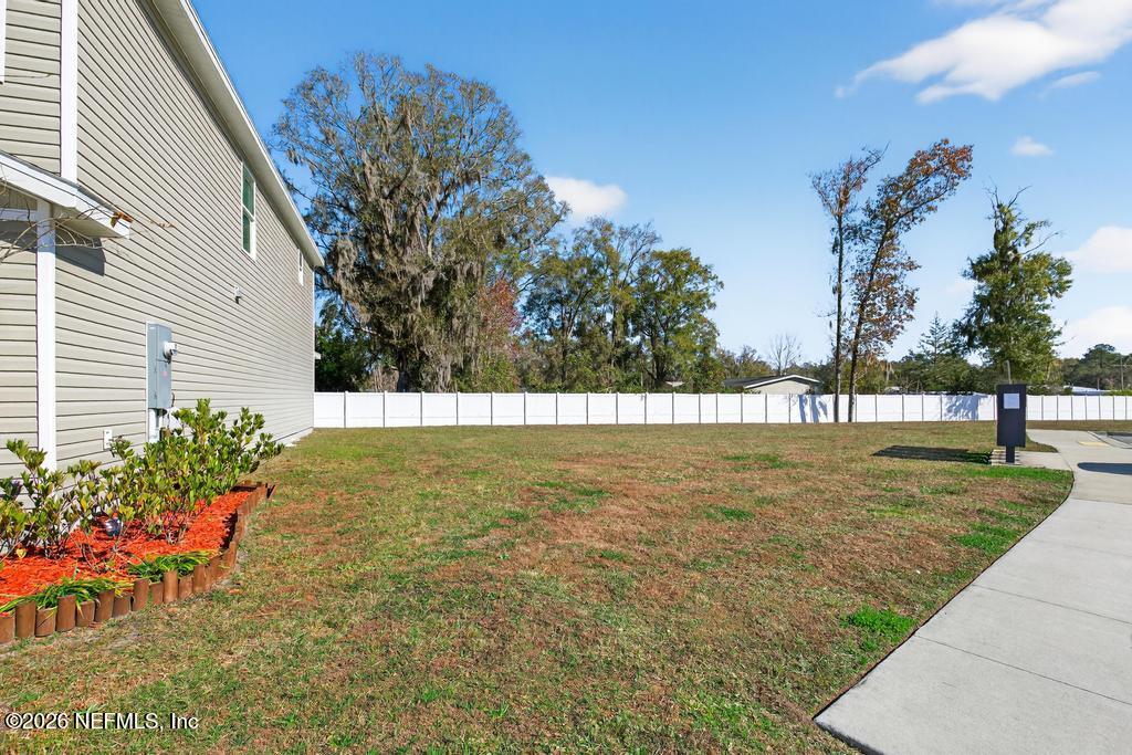 45124 Red Brick Drive Callahan, FL 32011 - Photo 50 of 54 a view of yard with swimming pool and seating