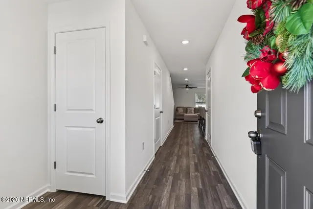 a view of a hallway and a potted plant