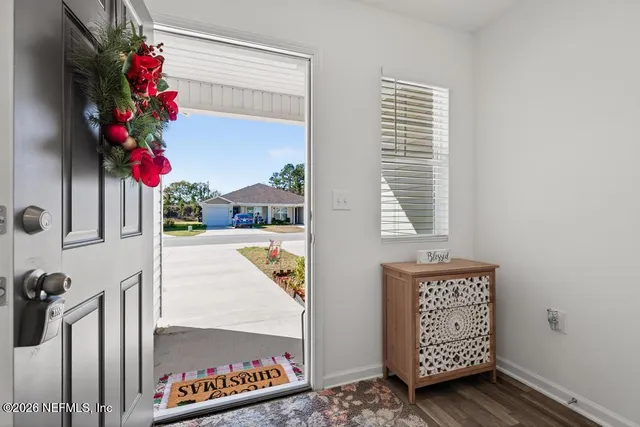 a view of entryway with wooden floor