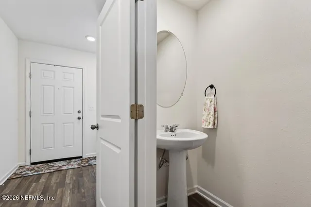 a bathroom with a sink and mirror