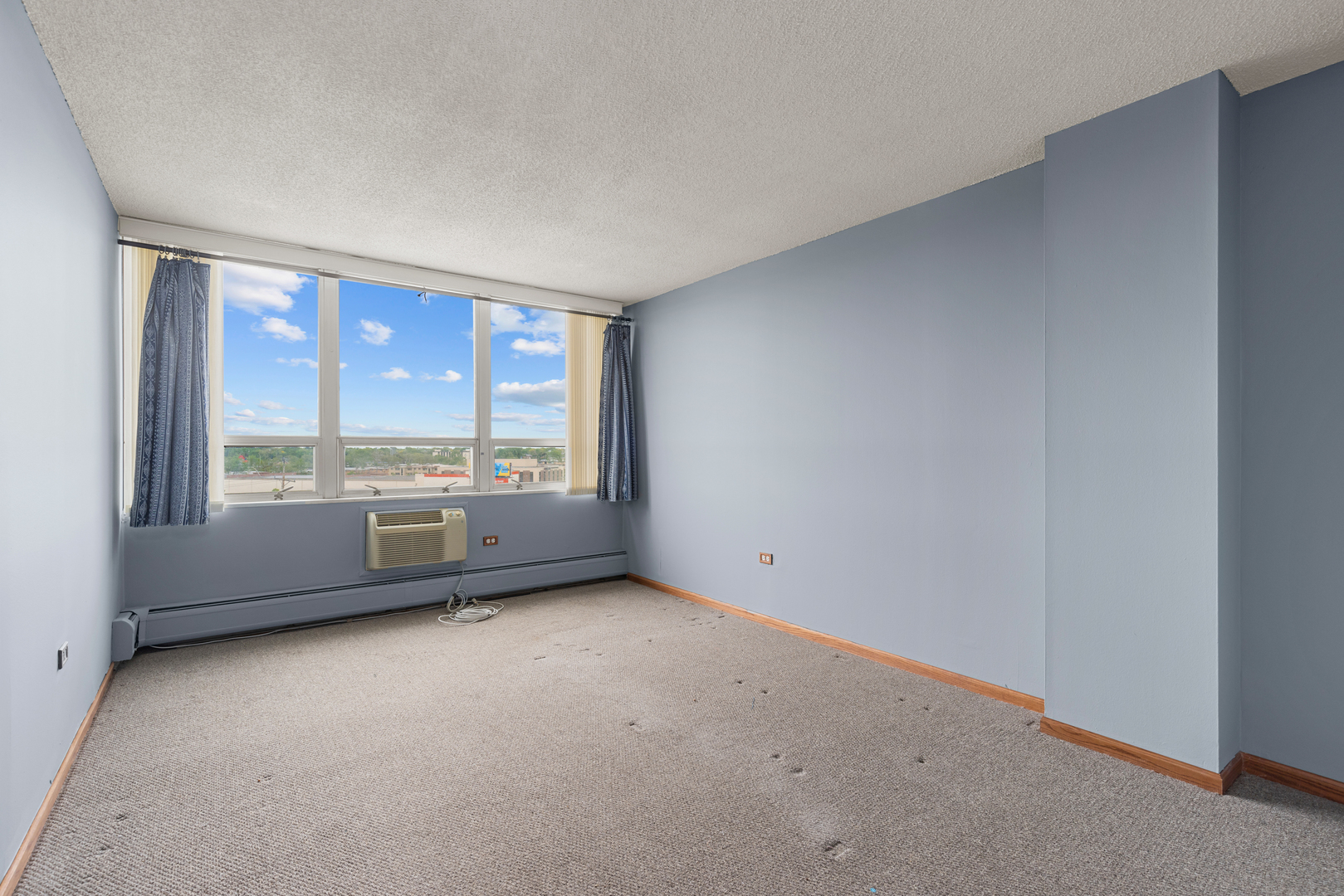 8815 West Golf Road, Unit 7A Niles, IL 60714 - Photo 15 of 26 a view of an empty room with a window