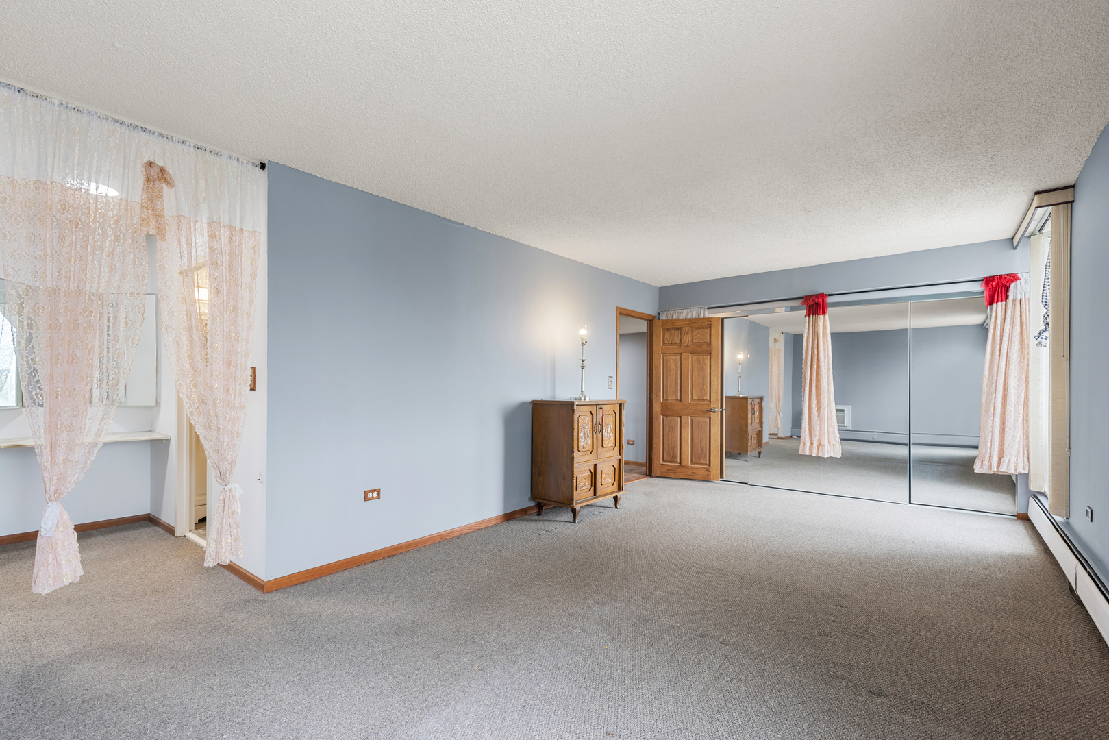 8815 West Golf Road, Unit 7A Niles, IL 60714 - Photo 19 of 26 a view of an empty room with a window