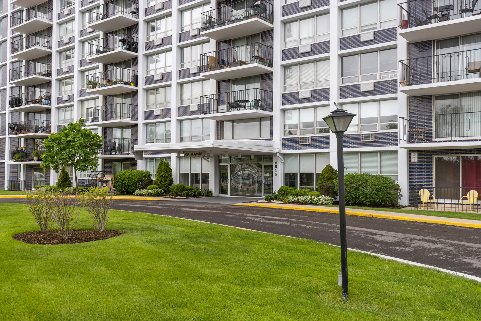 8815 West Golf Road, Unit 7A Niles, IL 60714 - Photo 2 of 26 a front view of building with yard
