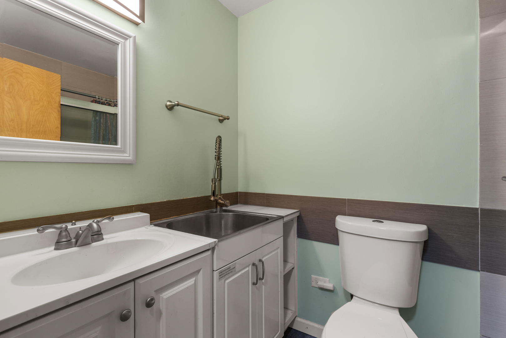 8815 West Golf Road, Unit 7A Niles, IL 60714 - Photo 21 of 26 a bathroom with a sink and a toilet