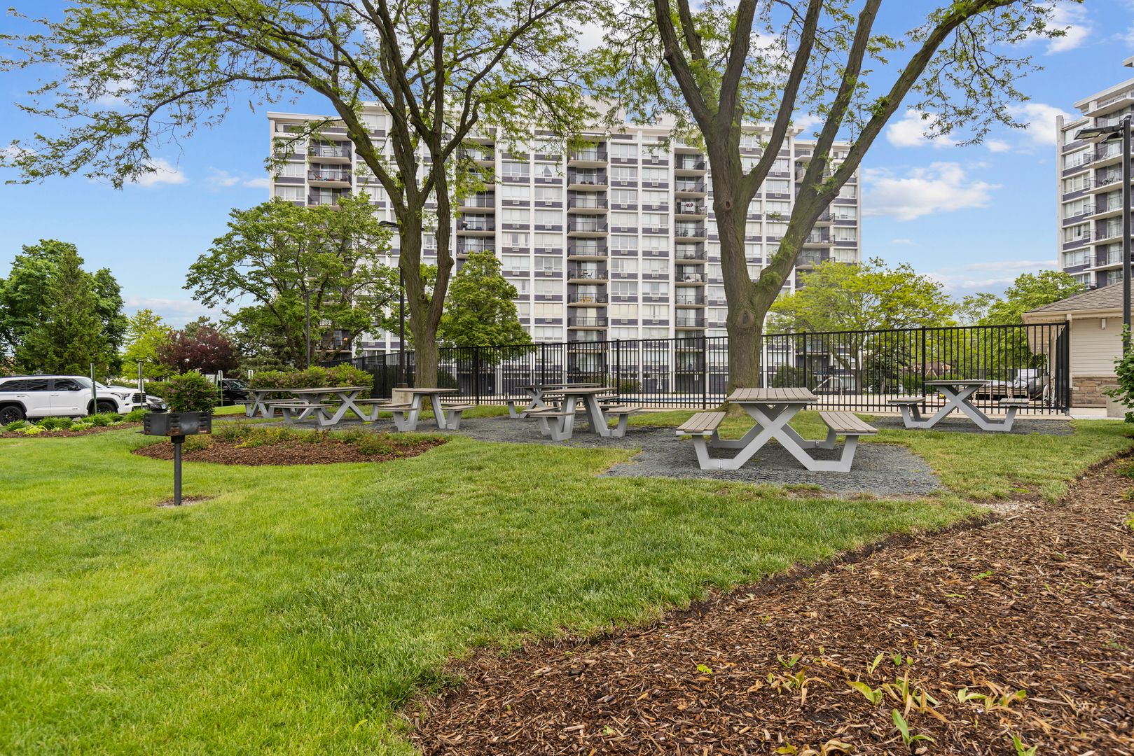8815 West Golf Road, Unit 7A Niles, IL 60714 - Photo 24 of 26 a view of yard with swimming pool and green space