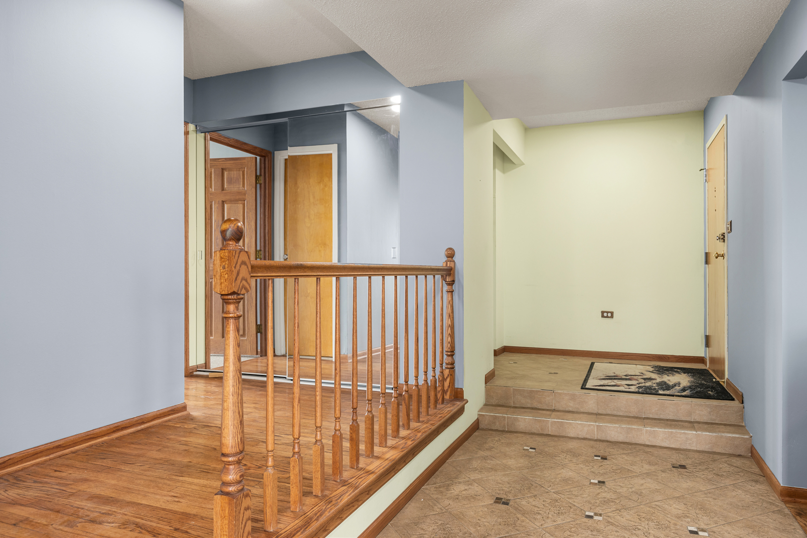 8815 West Golf Road, Unit 7A Niles, IL 60714 - Photo 5 of 26 a view of a hallway with wooden floor and a bathroom