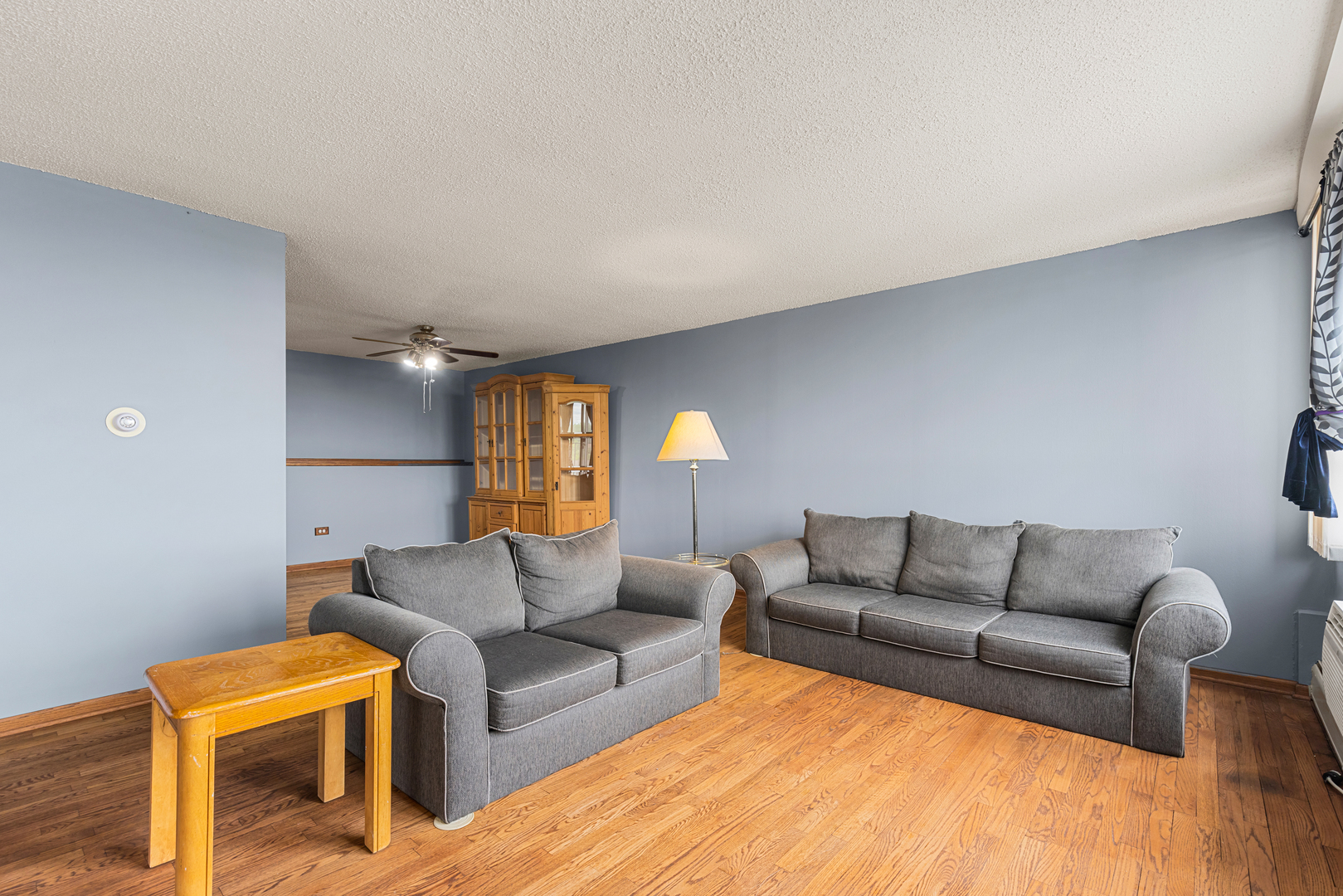 8815 West Golf Road, Unit 7A Niles, IL 60714 - Photo 8 of 26 a living room with furniture and a couch