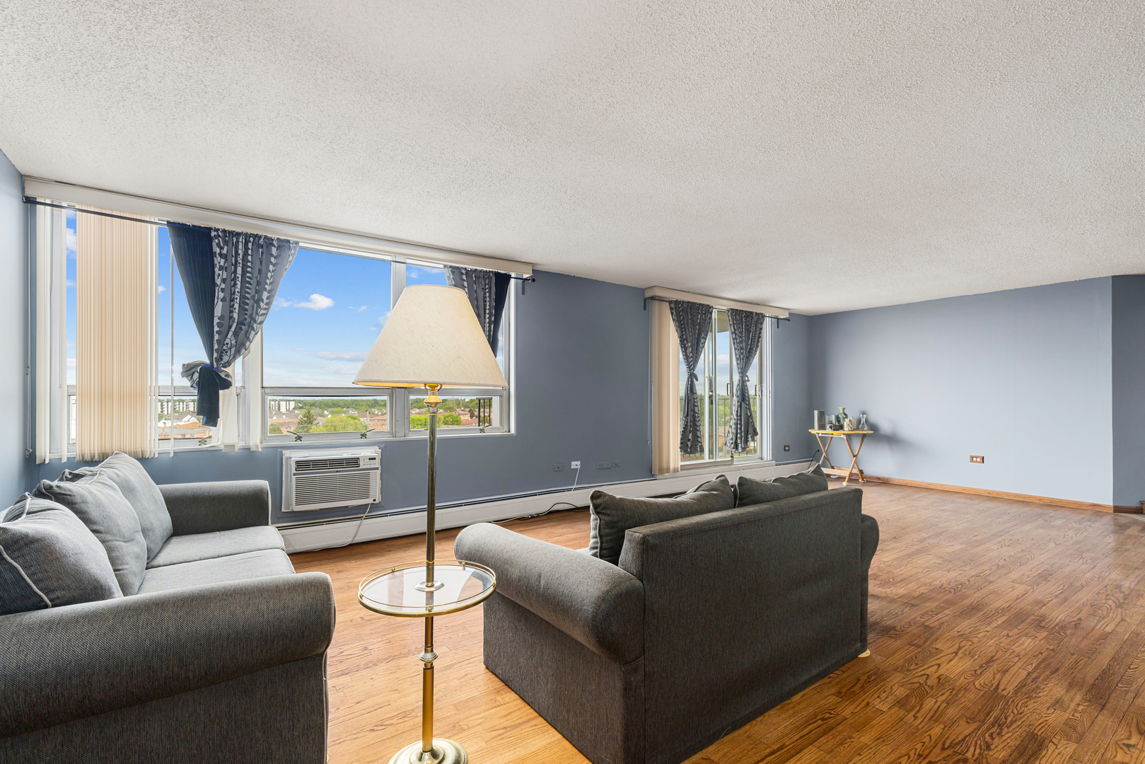 8815 West Golf Road, Unit 7A Niles, IL 60714 - Photo 9 of 26 a living room with furniture window and wooden floor
