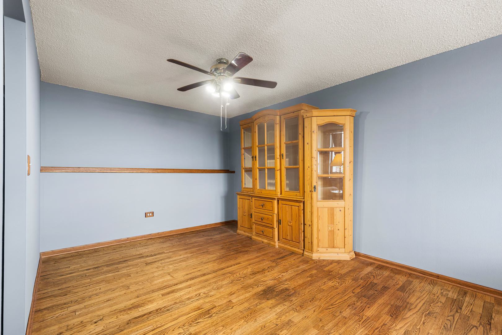8815 West Golf Road, Unit 7A Niles, IL 60714 - Photo 10 of 26 wooden floor in an empty room