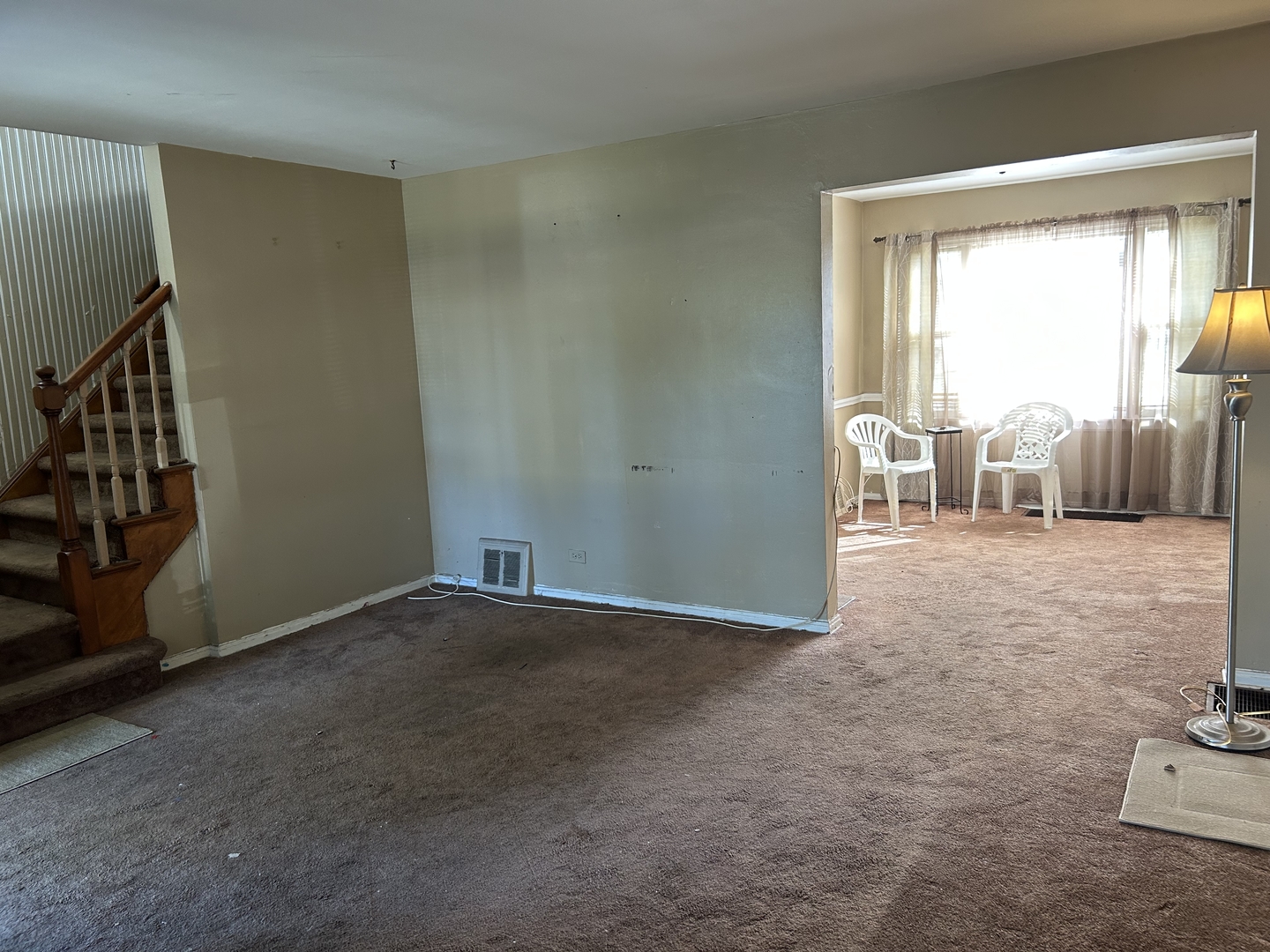 519 East 109th Street Chicago, IL 60628 - Photo 2 of 8 a view of an empty room and a window
