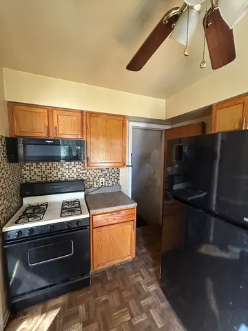 a kitchen with a stove and a microwave