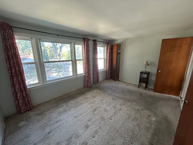 a view of empty room with front door