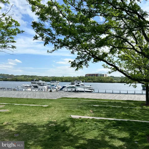 a view of a swimming pool with an outdoor space and seating area