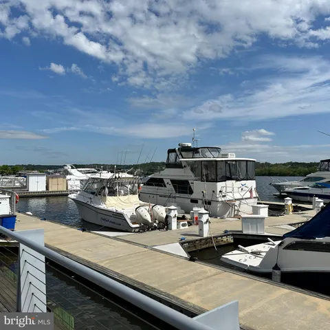 a view of a swimming pool in front of a big yard
