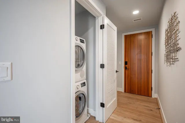 a view of a bathroom with washer and dryer