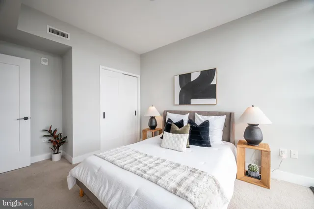 a bedroom with bed and window