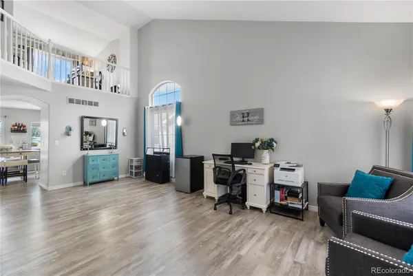 a view of a livingroom with furniture and a flat screen tv