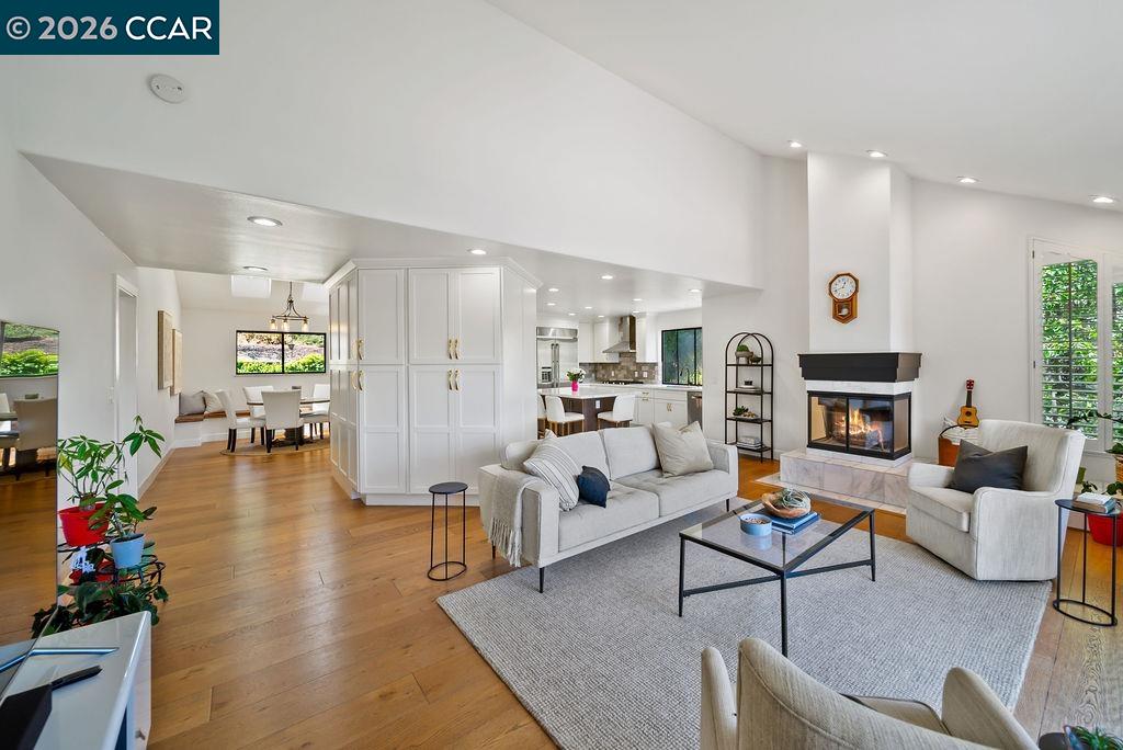 172 Rudgear Drive Walnut Creek, CA 94596 - Photo 20 of 51 a living room with fireplace furniture and a wooden floor
