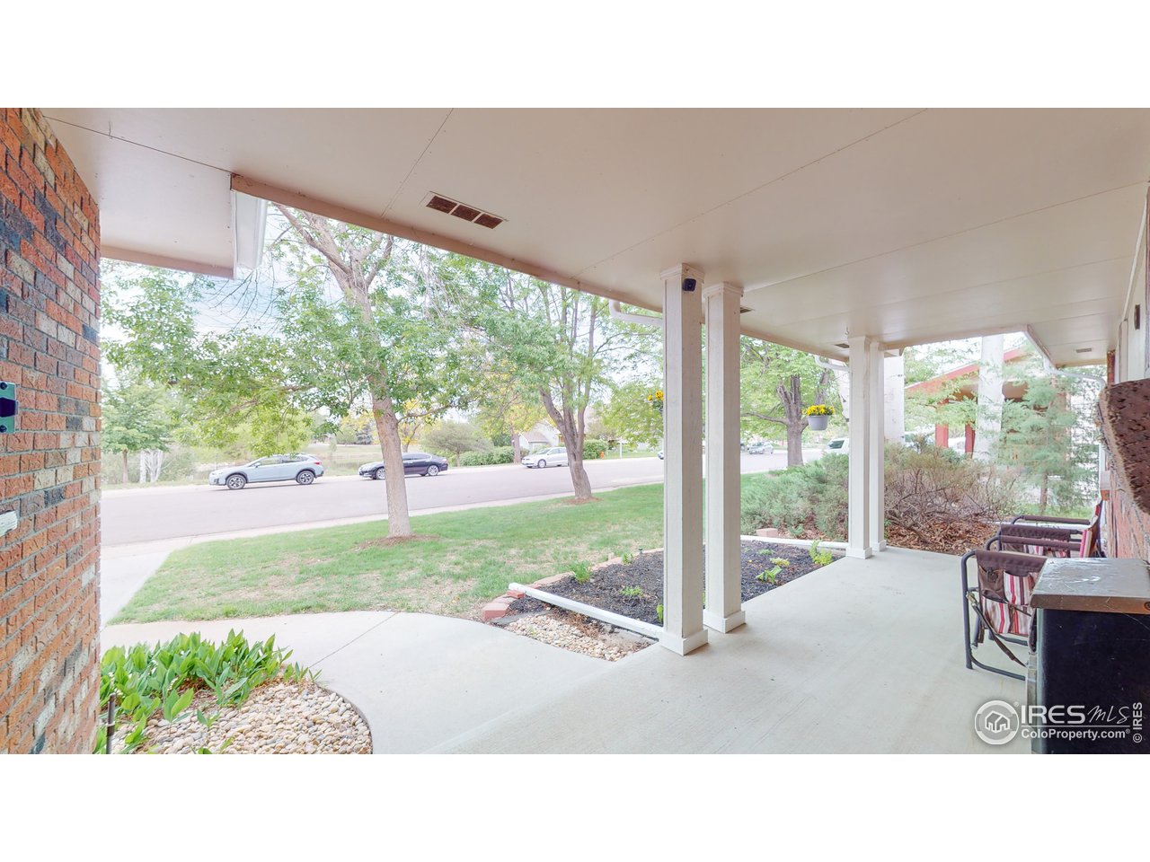 Nice front porch that looks to a park