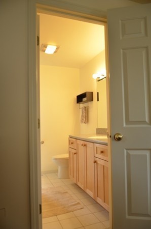 3 West Whitehall Road Amesbury, MA 01913 - Photo 14 of 18 a bathroom with a granite countertop sink and a mirror